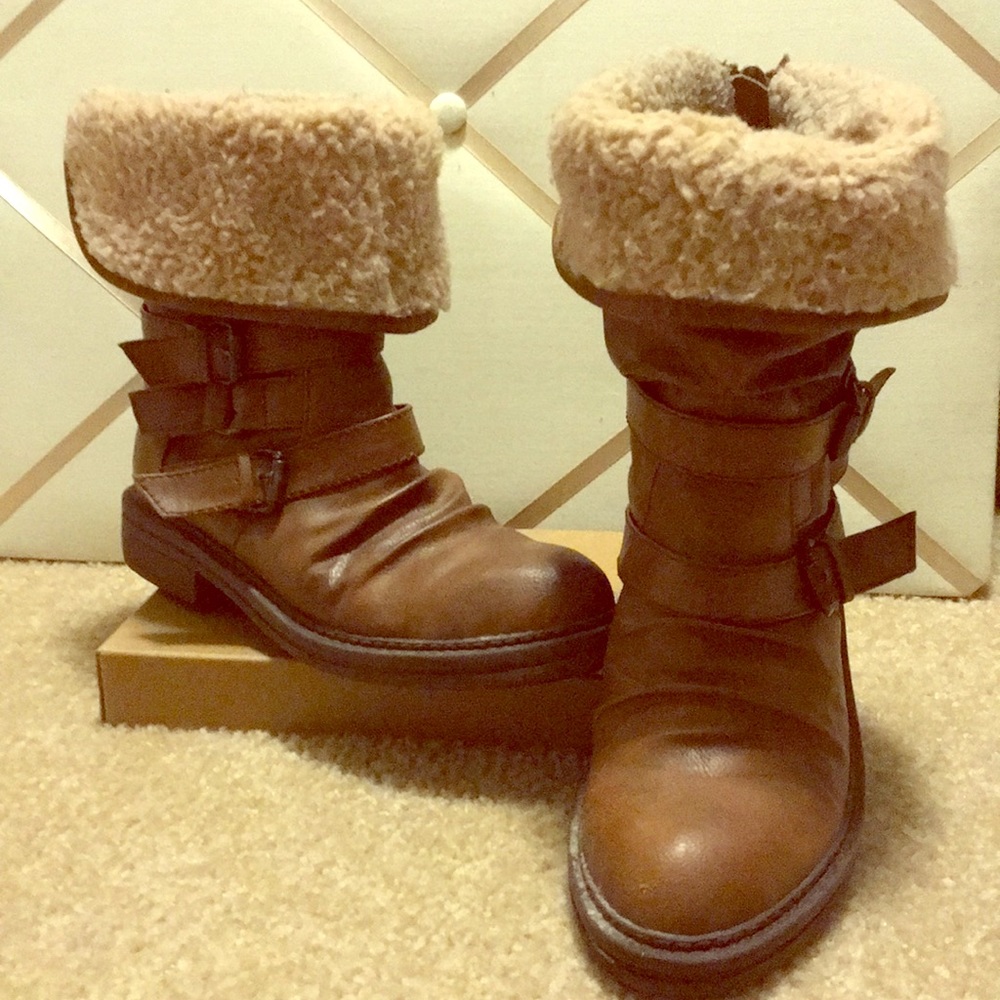 Boots. Brown and tan with buckles.